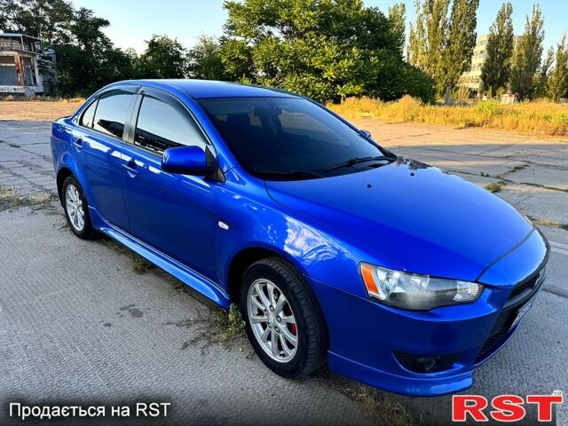 Синій Міцубісі Lancer, об'ємом двигуна 2 л та пробігом 261 тис. км за 7300 $, фото 1 на Automoto.ua
