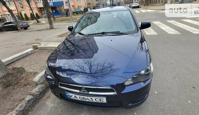 Синий Мицубиси Лансер, объемом двигателя 2 л и пробегом 150 тыс. км за 8500 $, фото 1 на Automoto.ua