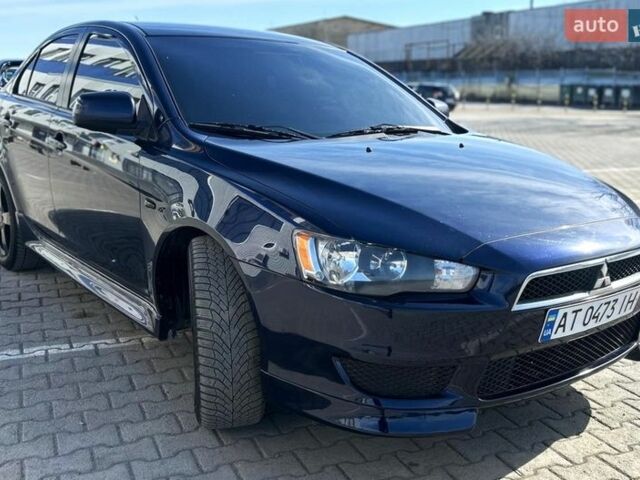 Синий Мицубиси Лансер, объемом двигателя 2 л и пробегом 170 тыс. км за 8700 $, фото 1 на Automoto.ua