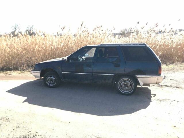 Синий Мицубиси Лансер, объемом двигателя 1.5 л и пробегом 777 тыс. км за 294 $, фото 1 на Automoto.ua