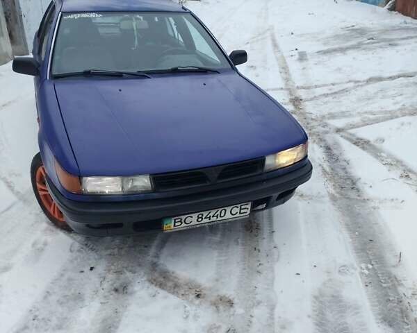 Синий Мицубиси Лансер, объемом двигателя 1 л и пробегом 291 тыс. км за 1177 $, фото 1 на Automoto.ua