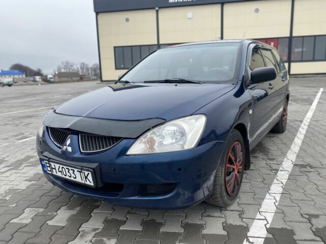 Синий Мицубиси Лансер, объемом двигателя 1.6 л и пробегом 240 тыс. км за 2600 $, фото 1 на Automoto.ua