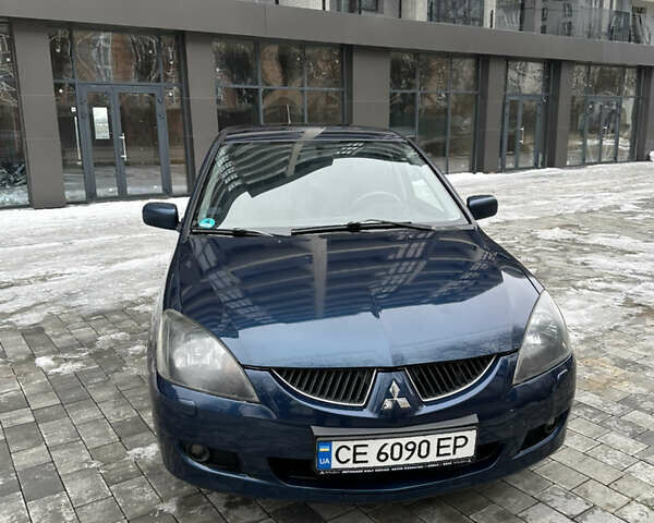 Синий Мицубиси Лансер, объемом двигателя 1.58 л и пробегом 293 тыс. км за 4299 $, фото 1 на Automoto.ua