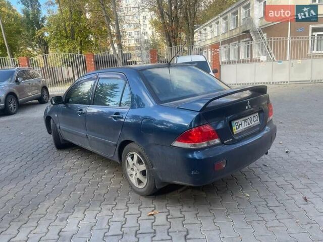 Синий Мицубиси Лансер, объемом двигателя 2 л и пробегом 237 тыс. км за 3499 $, фото 1 на Automoto.ua