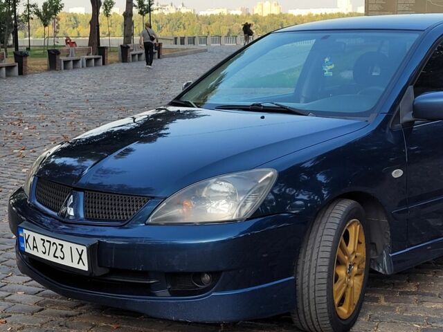 Синій Міцубісі Lancer, об'ємом двигуна 2 л та пробігом 277 тис. км за 5200 $, фото 1 на Automoto.ua