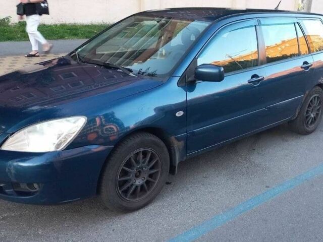 Синій Міцубісі Lancer, об'ємом двигуна 1.6 л та пробігом 245 тис. км за 3299 $, фото 1 на Automoto.ua