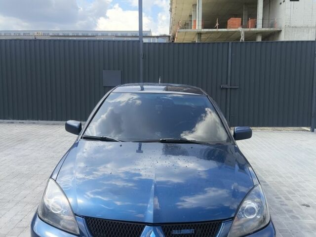 Синій Міцубісі Lancer, об'ємом двигуна 2 л та пробігом 330 тис. км за 4200 $, фото 1 на Automoto.ua