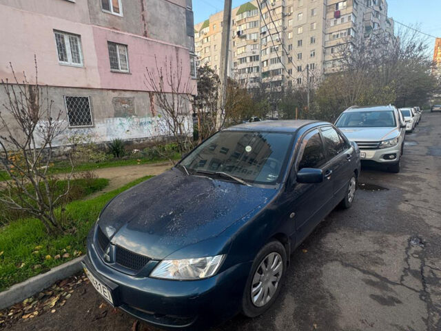 Синий Мицубиси Лансер, объемом двигателя 1.6 л и пробегом 267 тыс. км за 3900 $, фото 1 на Automoto.ua
