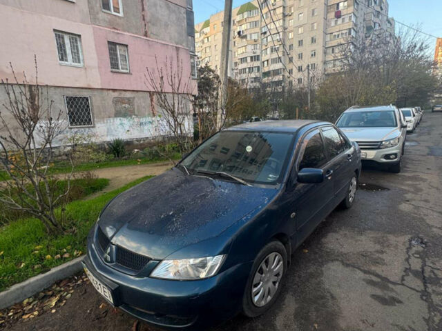 Синий Мицубиси Лансер, объемом двигателя 1.6 л и пробегом 267 тыс. км за 3500 $, фото 1 на Automoto.ua