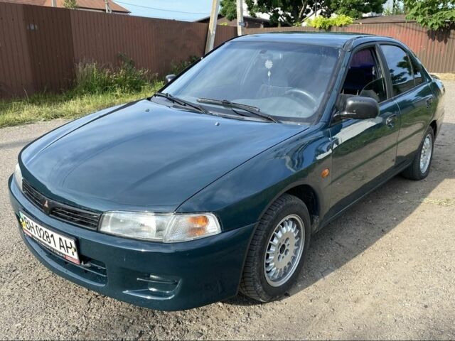 Зеленый Мицубиси Лансер, объемом двигателя 1.3 л и пробегом 300 тыс. км за 1650 $, фото 1 на Automoto.ua