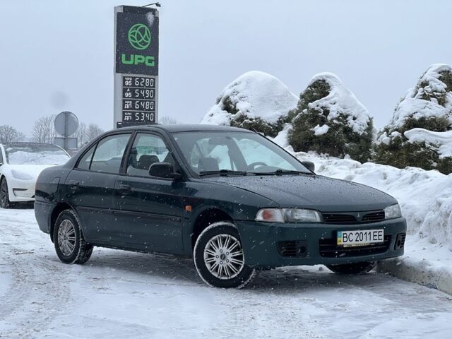 Зеленый Мицубиси Лансер, объемом двигателя 1.3 л и пробегом 259 тыс. км за 2349 $, фото 1 на Automoto.ua