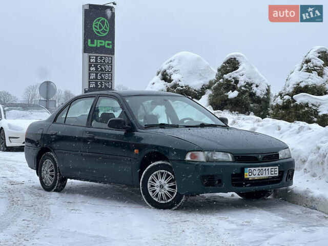 Зеленый Мицубиси Лансер, объемом двигателя 1.3 л и пробегом 260 тыс. км за 1999 $, фото 1 на Automoto.ua