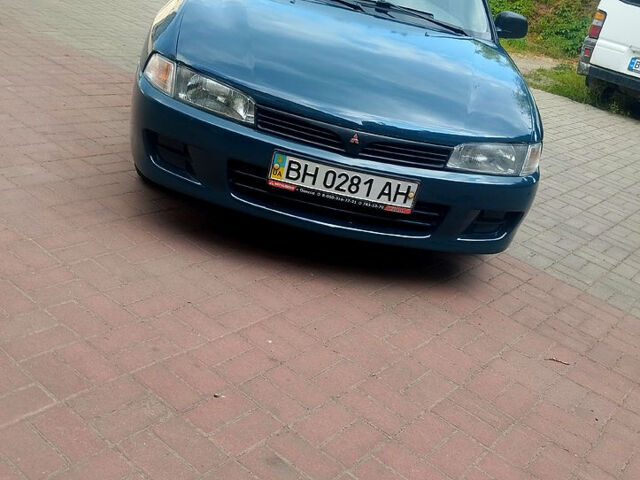 Зеленый Мицубиси Лансер, объемом двигателя 1.3 л и пробегом 300 тыс. км за 1550 $, фото 1 на Automoto.ua