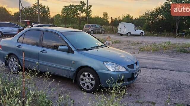 Зеленый Мицубиси Лансер, объемом двигателя 1.58 л и пробегом 243 тыс. км за 4300 $, фото 1 на Automoto.ua
