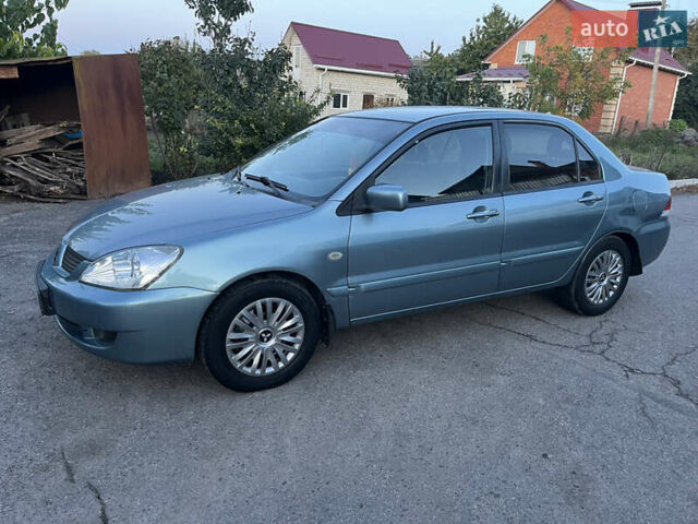 Зелений Міцубісі Lancer, об'ємом двигуна 1.6 л та пробігом 252 тис. км за 3650 $, фото 1 на Automoto.ua