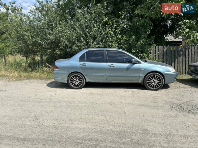 Зеленый Мицубиси Лансер, объемом двигателя 1.58 л и пробегом 306 тыс. км за 4400 $, фото 1 на Automoto.ua