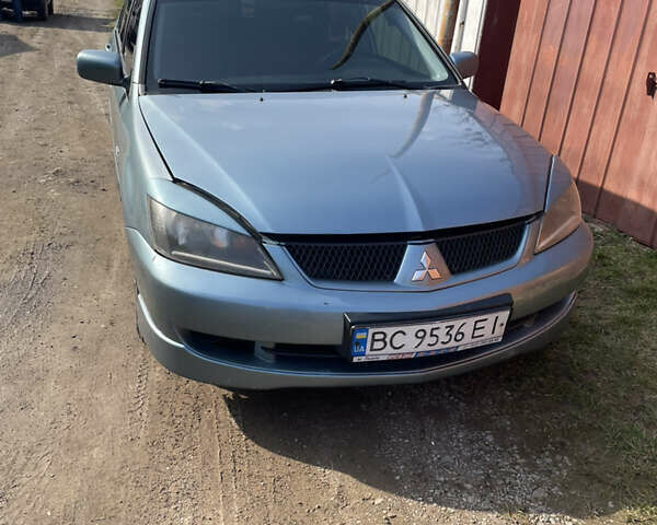 Зелений Міцубісі Lancer, об'ємом двигуна 2 л та пробігом 274 тис. км за 4399 $, фото 1 на Automoto.ua