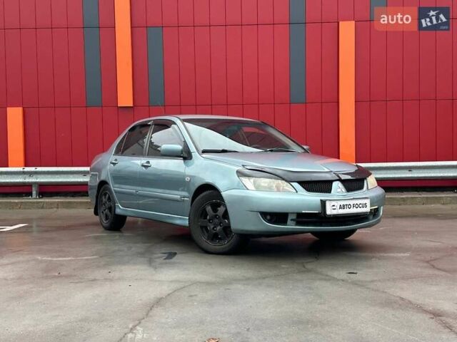Зелений Міцубісі Lancer, об'ємом двигуна 1.58 л та пробігом 208 тис. км за 3990 $, фото 1 на Automoto.ua