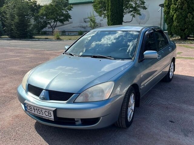 Зелений Міцубісі Lancer, об'ємом двигуна 1.58 л та пробігом 266 тис. км за 4100 $, фото 1 на Automoto.ua