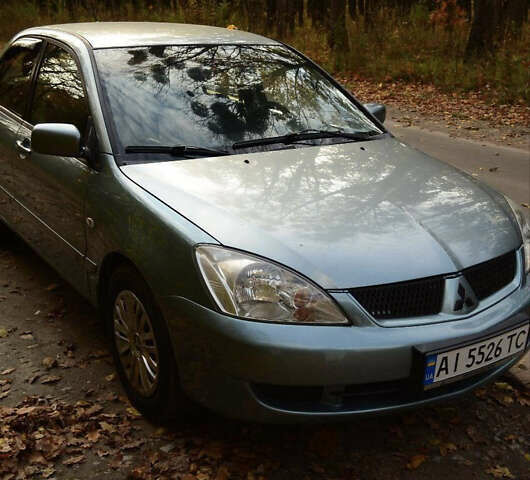 Зеленый Мицубиси Лансер, объемом двигателя 1.58 л и пробегом 259 тыс. км за 4300 $, фото 1 на Automoto.ua