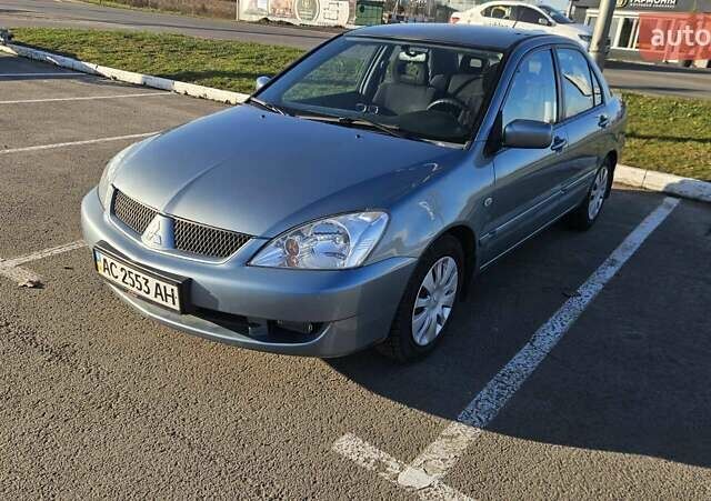 Зелений Міцубісі Lancer, об'ємом двигуна 1.58 л та пробігом 215 тис. км за 5000 $, фото 1 на Automoto.ua