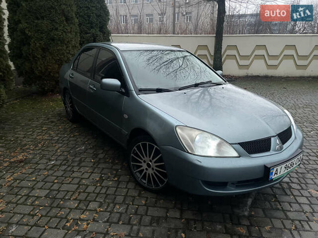 Зеленый Мицубиси Лансер, объемом двигателя 1.58 л и пробегом 313 тыс. км за 4150 $, фото 1 на Automoto.ua