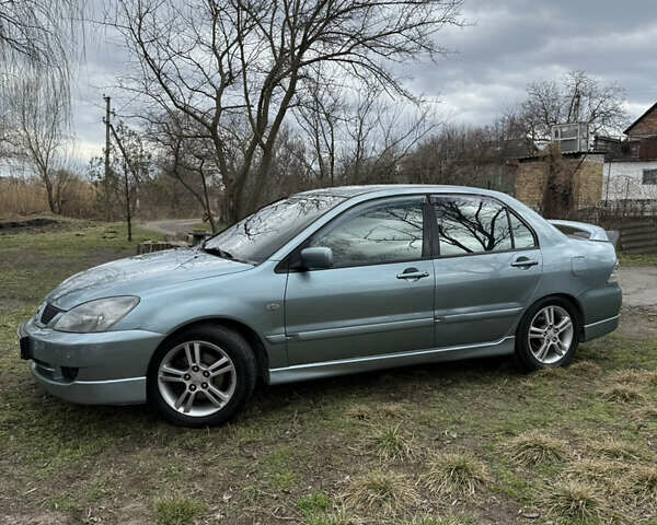 Зелений Міцубісі Lancer, об'ємом двигуна 2 л та пробігом 225 тис. км за 5599 $, фото 1 на Automoto.ua