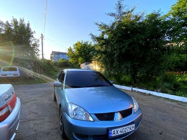 Зеленый Мицубиси Лансер, объемом двигателя 1.6 л и пробегом 238 тыс. км за 4000 $, фото 1 на Automoto.ua