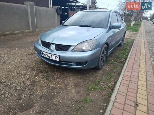 Зелений Міцубісі Lancer, об'ємом двигуна 2 л та пробігом 238 тис. км за 2999 $, фото 1 на Automoto.ua