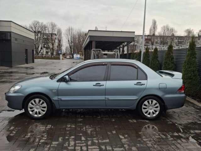 Зеленый Мицубиси Лансер, объемом двигателя 1.6 л и пробегом 165 тыс. км за 5500 $, фото 1 на Automoto.ua