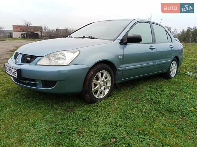 Зеленый Мицубиси Лансер, объемом двигателя 1.58 л и пробегом 300 тыс. км за 3999 $, фото 1 на Automoto.ua
