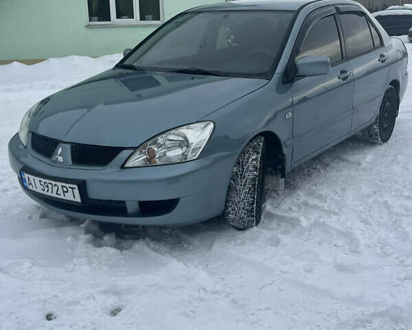 Зеленый Мицубиси Лансер, объемом двигателя 1.6 л и пробегом 257 тыс. км за 4950 $, фото 1 на Automoto.ua