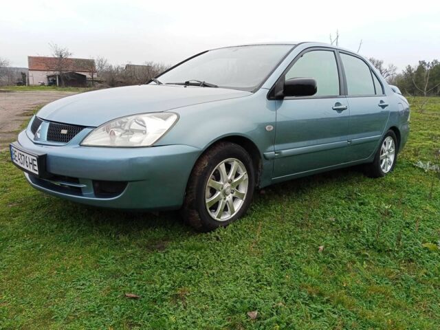 Зеленый Мицубиси Лансер, объемом двигателя 1.6 л и пробегом 319 тыс. км за 3300 $, фото 1 на Automoto.ua