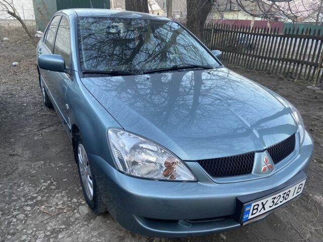 Зеленый Мицубиси Лансер, объемом двигателя 1.6 л и пробегом 98 тыс. км за 5800 $, фото 1 на Automoto.ua