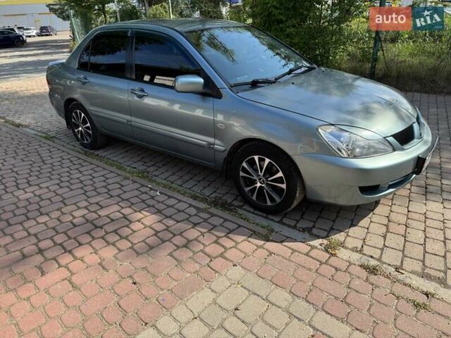 Зеленый Мицубиси Лансер, объемом двигателя 1.6 л и пробегом 137 тыс. км за 5500 $, фото 1 на Automoto.ua