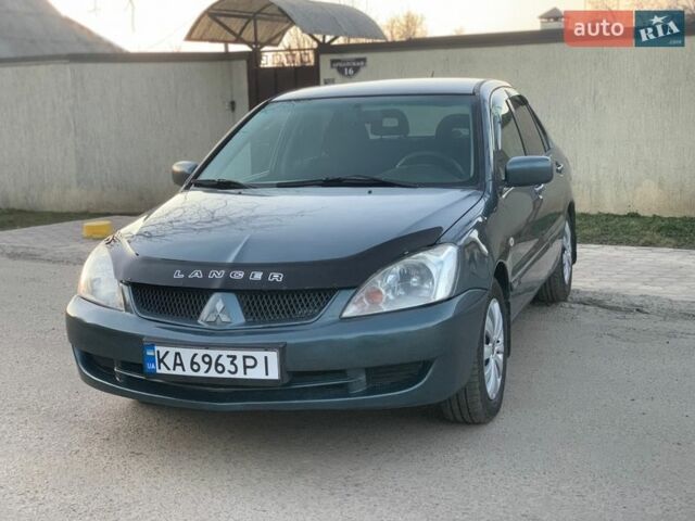 Зеленый Мицубиси Лансер, объемом двигателя 1.6 л и пробегом 259 тыс. км за 3999 $, фото 1 на Automoto.ua