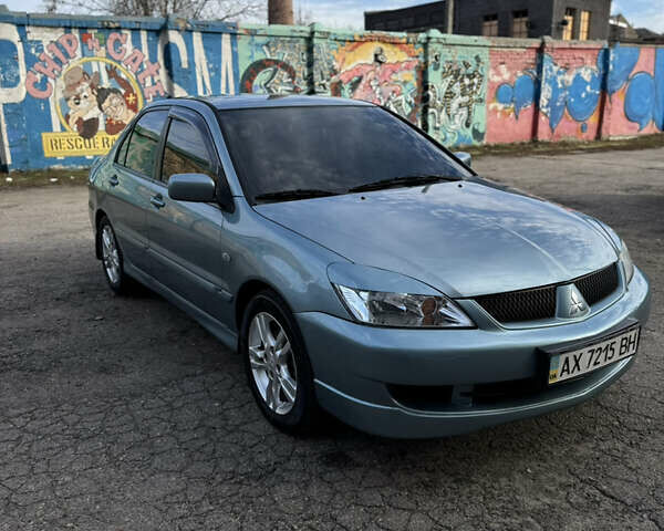 Зелений Міцубісі Lancer, об'ємом двигуна 1.6 л та пробігом 164 тис. км за 6000 $, фото 1 на Automoto.ua