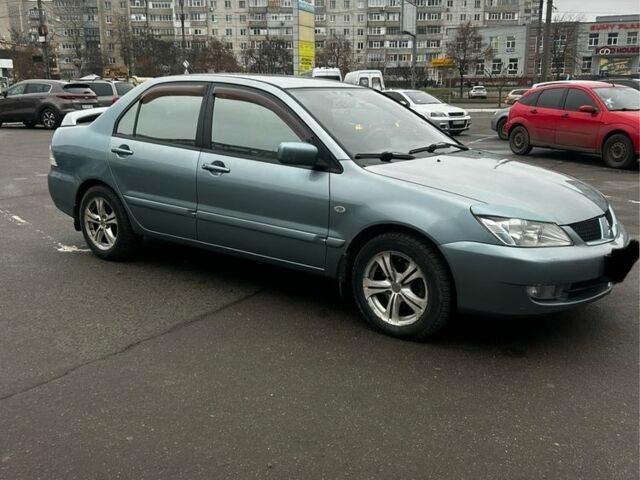 Зеленый Мицубиси Лансер, объемом двигателя 1.6 л и пробегом 234 тыс. км за 5300 $, фото 1 на Automoto.ua