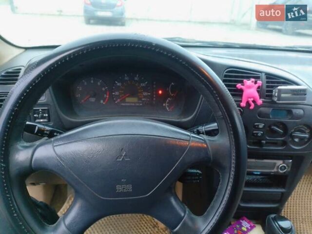 Черный Мицубиси Мираж, объемом двигателя 1.8 л и пробегом 240 тыс. км за 2500 $, фото 1 на Automoto.ua