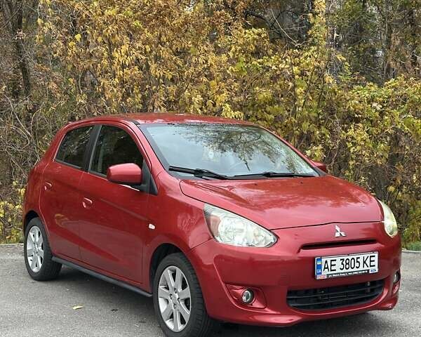 Красный Мицубиси Мираж, объемом двигателя 1.2 л и пробегом 102 тыс. км за 6900 $, фото 1 на Automoto.ua