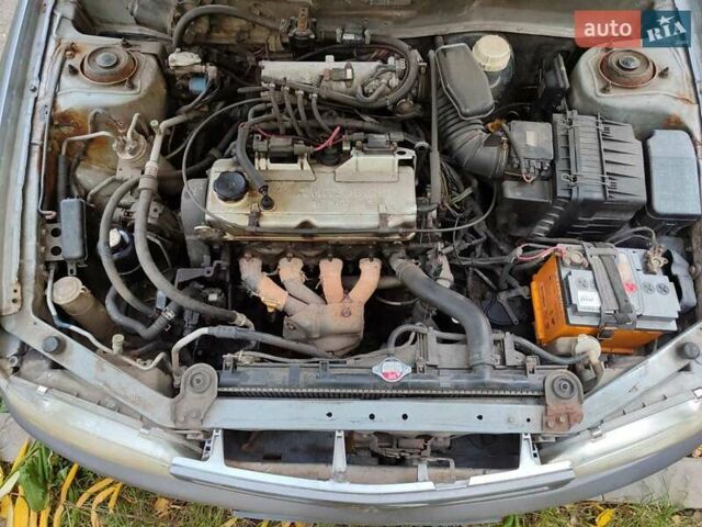 Сірий Міцубісі Міраж, об'ємом двигуна 1.8 л та пробігом 210 тис. км за 1850 $, фото 1 на Automoto.ua