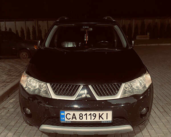 Черный Мицубиси Аутлендер ХЛ, объемом двигателя 3 л и пробегом 253 тыс. км за 9800 $, фото 1 на Automoto.ua