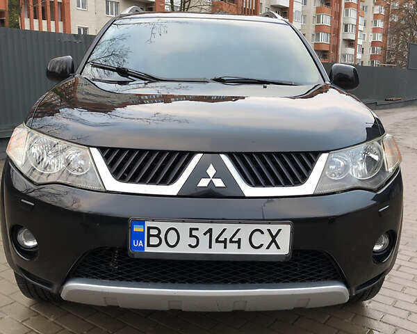 Черный Мицубиси Аутлендер ХЛ, объемом двигателя 3 л и пробегом 207 тыс. км за 9300 $, фото 1 на Automoto.ua