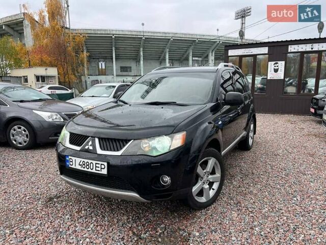 Черный Мицубиси Аутлендер ХЛ, объемом двигателя 3 л и пробегом 245 тыс. км за 9300 $, фото 1 на Automoto.ua