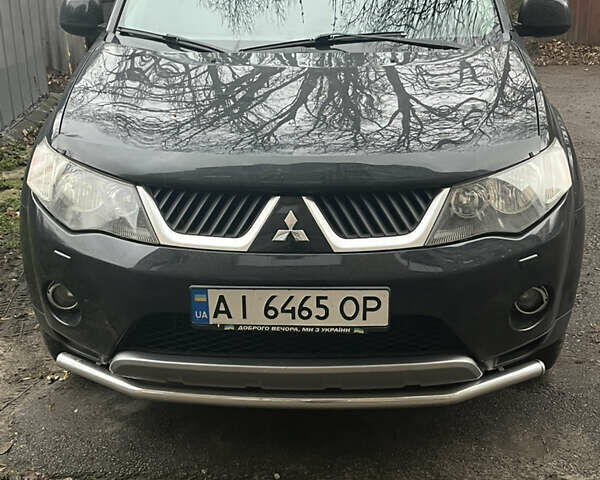 Черный Мицубиси Аутлендер ХЛ, объемом двигателя 3 л и пробегом 169 тыс. км за 9300 $, фото 1 на Automoto.ua