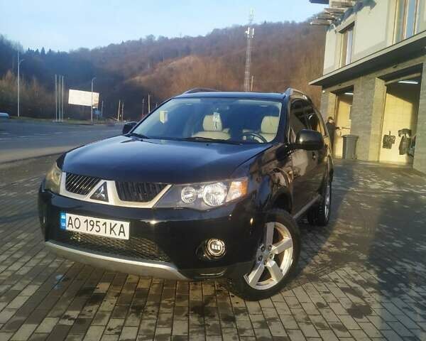 Черный Мицубиси Аутлендер ХЛ, объемом двигателя 3 л и пробегом 130 тыс. км за 6000 $, фото 1 на Automoto.ua