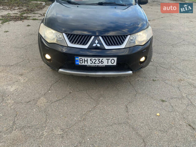 Черный Мицубиси Аутлендер ХЛ, объемом двигателя 1.97 л и пробегом 207 тыс. км за 8200 $, фото 1 на Automoto.ua