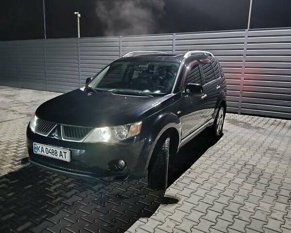 Чорний Міцубісі Аутлендер ХЛ, об'ємом двигуна 2.36 л та пробігом 390 тис. км за 7500 $, фото 1 на Automoto.ua