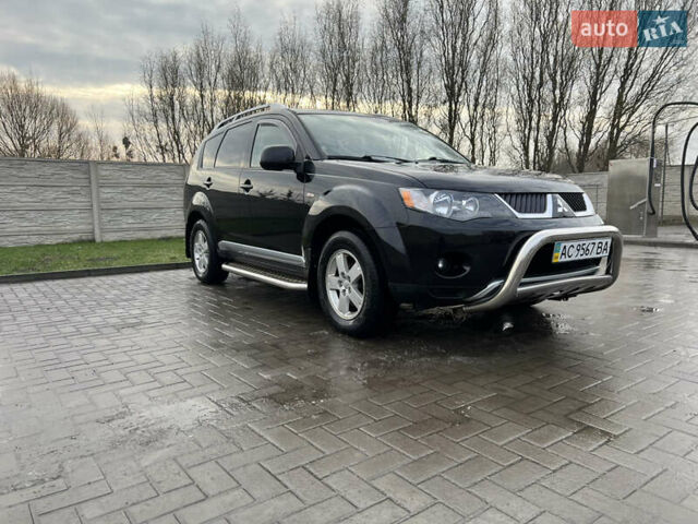 Черный Мицубиси Аутлендер ХЛ, объемом двигателя 2.36 л и пробегом 216 тыс. км за 7500 $, фото 1 на Automoto.ua