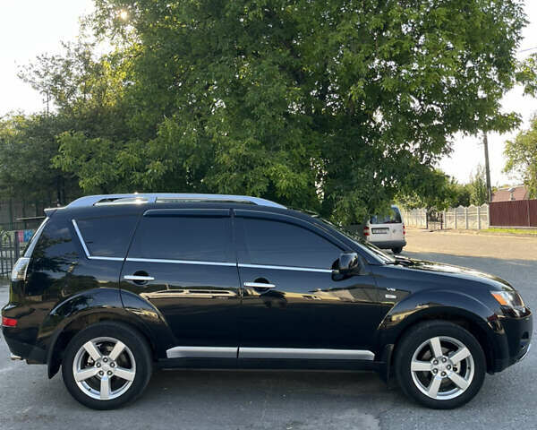 Черный Мицубиси Аутлендер ХЛ, объемом двигателя 2.99 л и пробегом 153 тыс. км за 10800 $, фото 1 на Automoto.ua